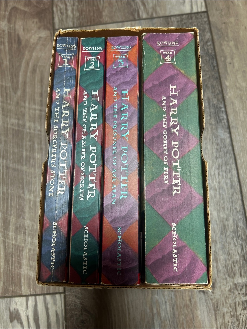 Scholastic Harry Potter 4-Book Set with Green and Purple Spines